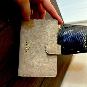 Coach light beige medium wallet with cranberry interior